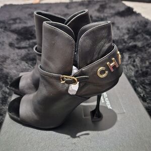 CHANEL Black Ankle Boots with Gold Accents